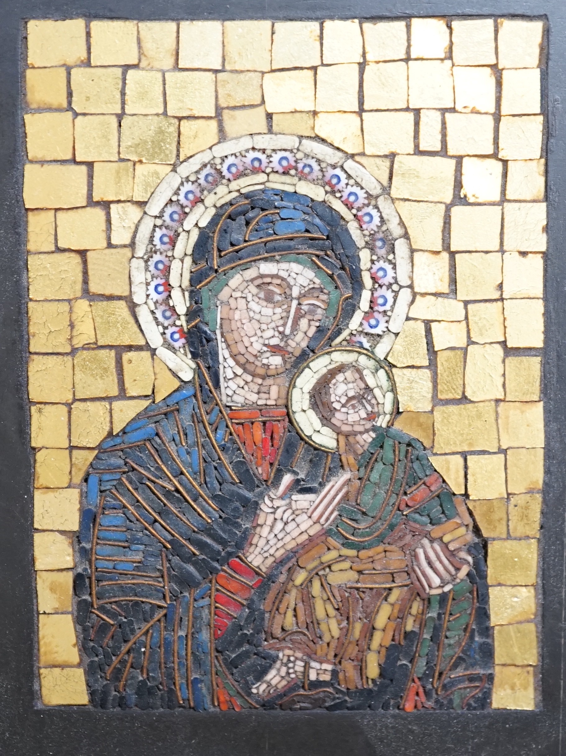 An early 20th century micro mosaic, ‘madonna del perpetuo soccorso’ framed with Vatican label verso, 19x17cm including frame